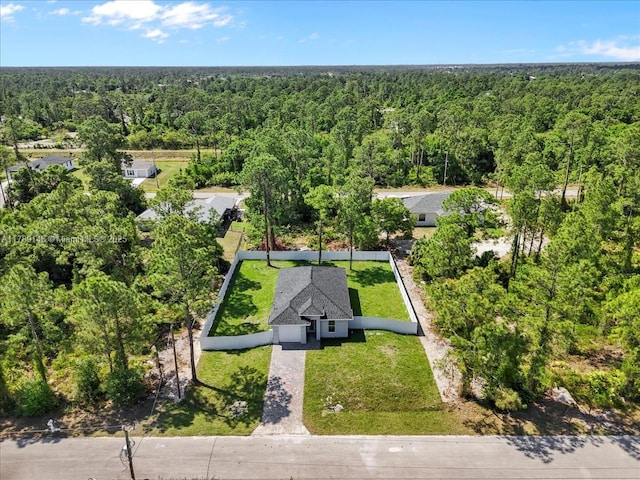 924 Berg St E, Lehigh Acres, FL 33974 - birds eye view of property with a forest view