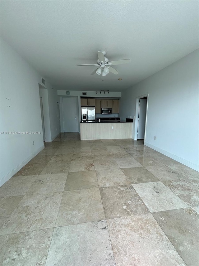 79 SW 12th St Unit 2703-S, Miami, FL 33130 - unfurnished living room with visible vents, baseboards, stone finish flooring, and ceiling fan