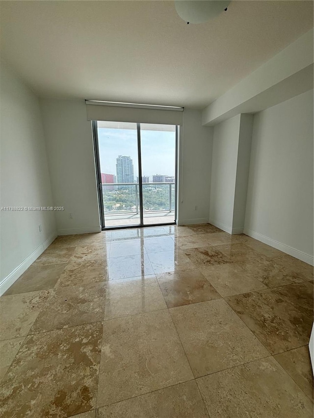 79 SW 12th St Unit 2703-S, Miami, FL 33130 - unfurnished room featuring baseboards