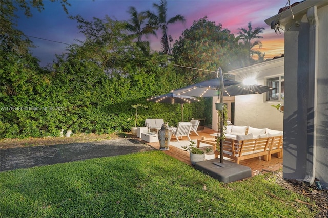 558 NE 94th St, Miami Shores, FL 33138 - view of yard featuring a wooden deck and outdoor lounge area
