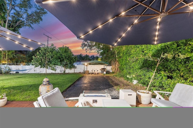 558 NE 94th St, Miami Shores, FL 33138 - patio terrace at dusk with a patio