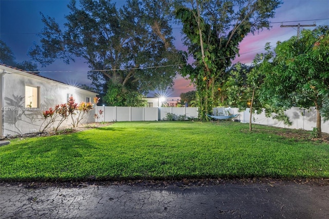 558 NE 94th St, Miami Shores, FL 33138 - yard at dusk with fence