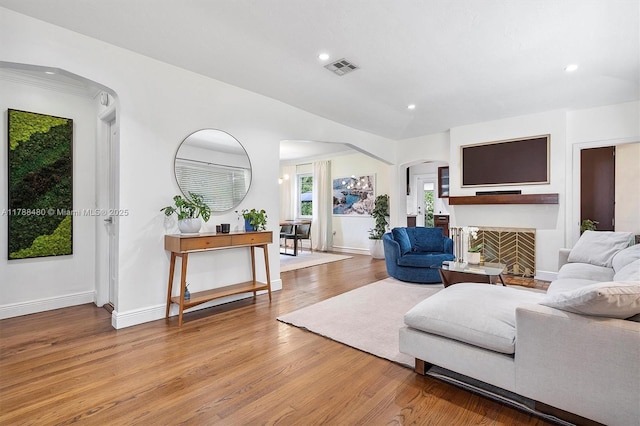 558 NE 94th St, Miami Shores, FL 33138 - living area with recessed lighting, wood finished floors, visible vents, arched walkways, and baseboards