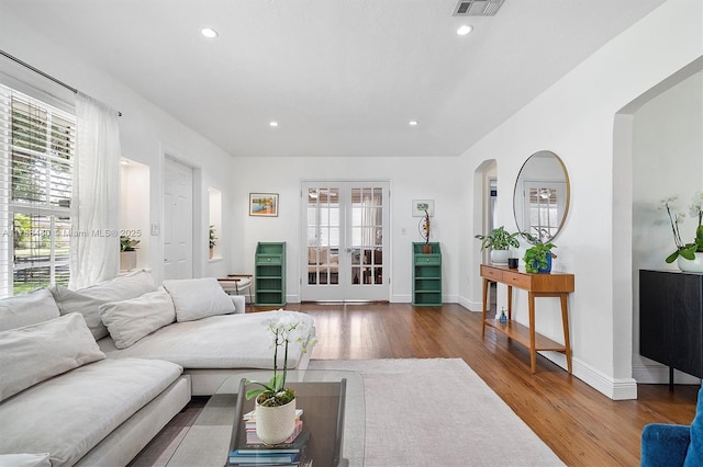 558 NE 94th St, Miami Shores, FL 33138 - living area with wood finished floors, recessed lighting, and a healthy amount of sunlight