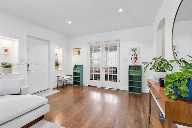 558 NE 94th St, Miami Shores, FL 33138 - interior space featuring recessed lighting, wood finished floors, french doors, arched walkways, and baseboards