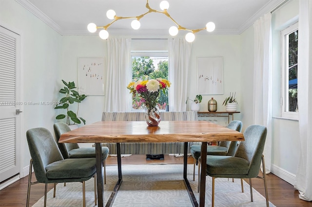 558 NE 94th St, Miami Shores, FL 33138 - dining space featuring crown molding, wood finished floors, and a chandelier