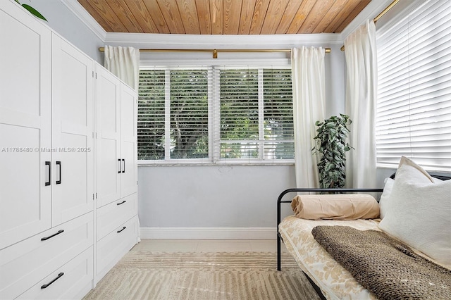 558 NE 94th St, Miami Shores, FL 33138 - living area featuring light tile patterned flooring, wood ceiling, baseboards, and ornamental molding