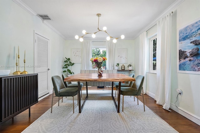 558 NE 94th St, Miami Shores, FL 33138 - dining area featuring visible vents, baseboards, an inviting chandelier, and crown molding