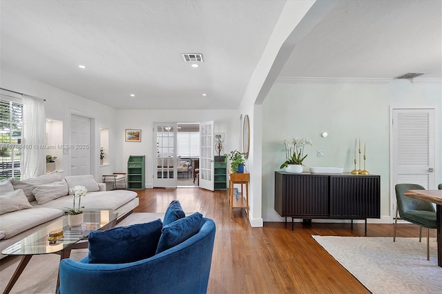 558 NE 94th St, Miami Shores, FL 33138 - living room with plenty of natural light, wood finished floors, and visible vents