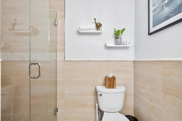 558 NE 94th St, Miami Shores, FL 33138 - bathroom with a shower stall and wainscoting