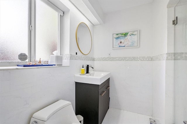 558 NE 94th St, Miami Shores, FL 33138 - bathroom with tile walls, plenty of natural light, vanity, and toilet