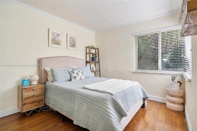 558 NE 94th St, Miami Shores, FL 33138 - bedroom featuring baseboards, ornamental molding, and hardwood / wood-style floors