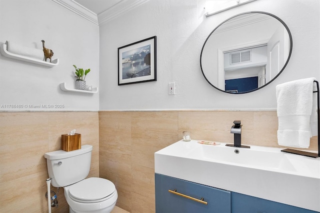 558 NE 94th St, Miami Shores, FL 33138 - bathroom featuring crown molding, vanity, tile walls, toilet, and visible vents