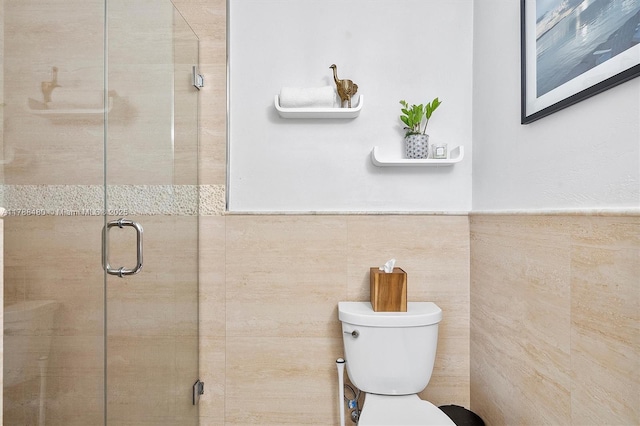 558 NE 94th St, Miami Shores, FL 33138 - bathroom featuring wainscoting, toilet, and a stall shower