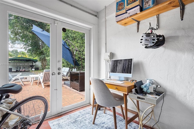 558 NE 94th St, Miami Shores, FL 33138 - office area featuring a textured wall, a wealth of natural light, and french doors