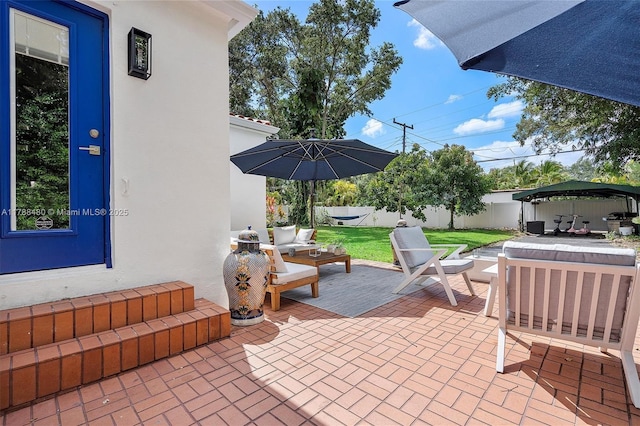 558 NE 94th St, Miami Shores, FL 33138 - view of patio / terrace featuring a fenced backyard and an outdoor living space