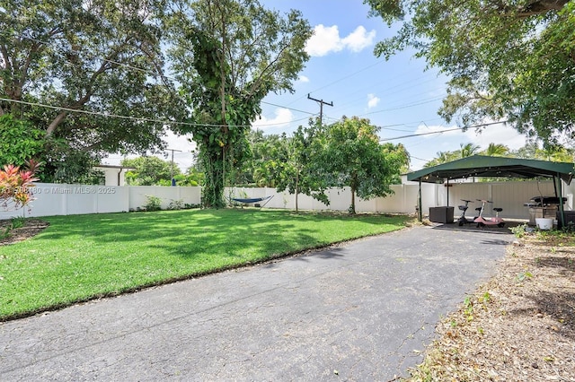 558 NE 94th St, Miami Shores, FL 33138 - exterior space with driveway, central AC, and fence