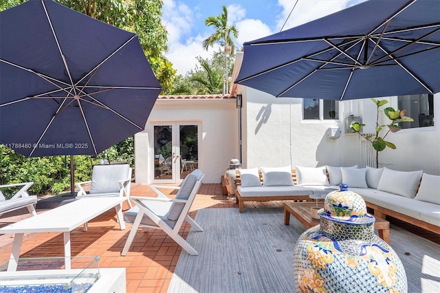 558 NE 94th St, Miami Shores, FL 33138 - wooden deck featuring outdoor lounge area and french doors