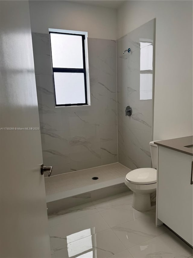 1037 NW 1st Ave Unit A, Florida City, FL 33034 - bathroom featuring marble finish flooring, a stall shower, toilet, and vanity