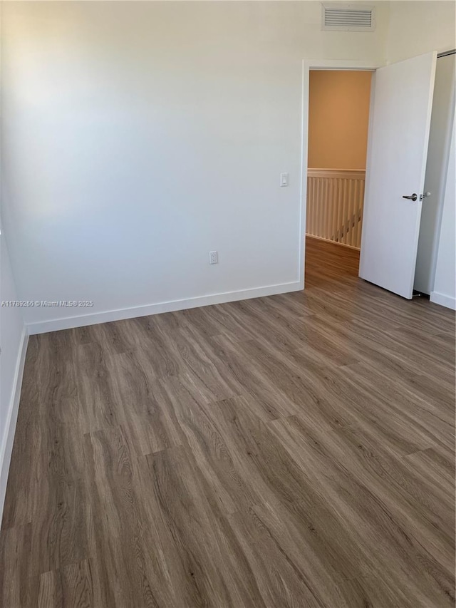 1037 NW 1st Ave Unit A, Florida City, FL 33034 - unfurnished room featuring wood finished floors and baseboards