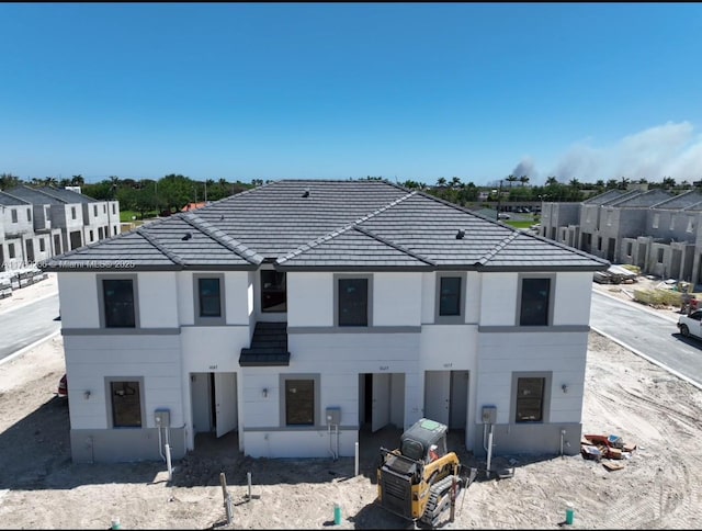 1037 NW 1st Ave Unit A, Florida City, FL 33034 - view of front facade with a tile roof and stucco siding