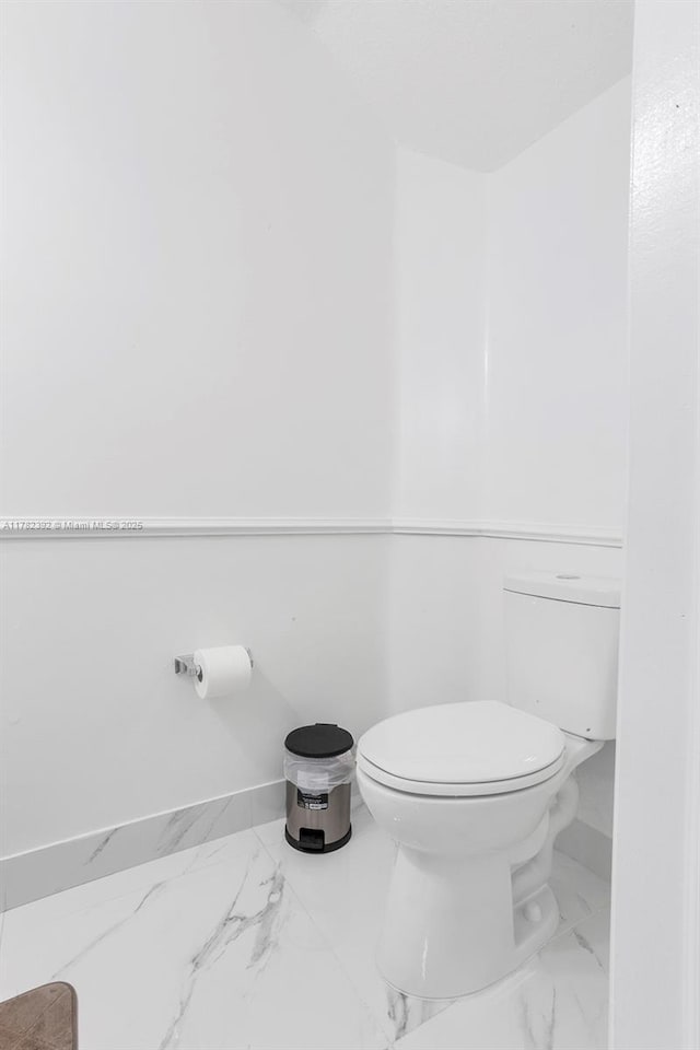 7225 NW 173rd Dr Unit 904-9, Hialeah, FL 33015 - bathroom featuring baseboards, marble finish floor, and toilet