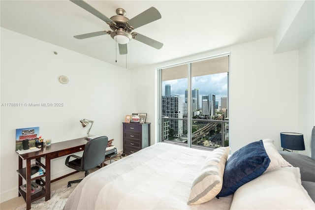 79 SW 12th St Unit 2011-S, Miami, FL 33130 - bedroom featuring floor to ceiling windows, a ceiling fan, access to exterior, baseboards, and a city view