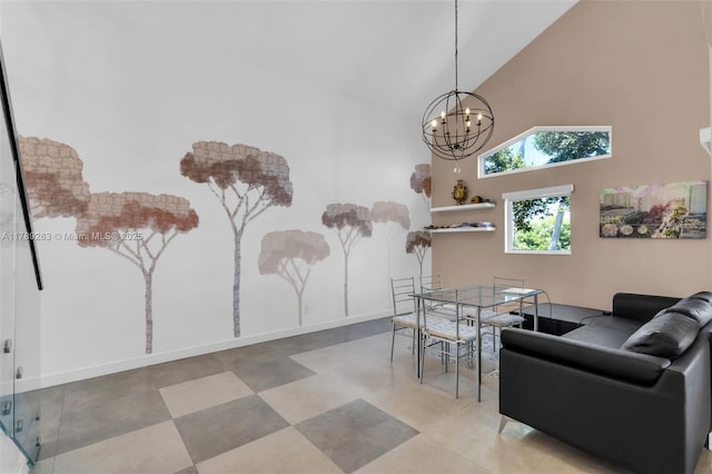 living room with high vaulted ceiling and a chandelier
