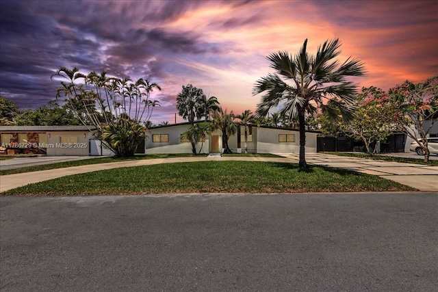 15020 NE 7th Ave, Miami, FL 33161 - view of front facade with curved driveway and a front lawn