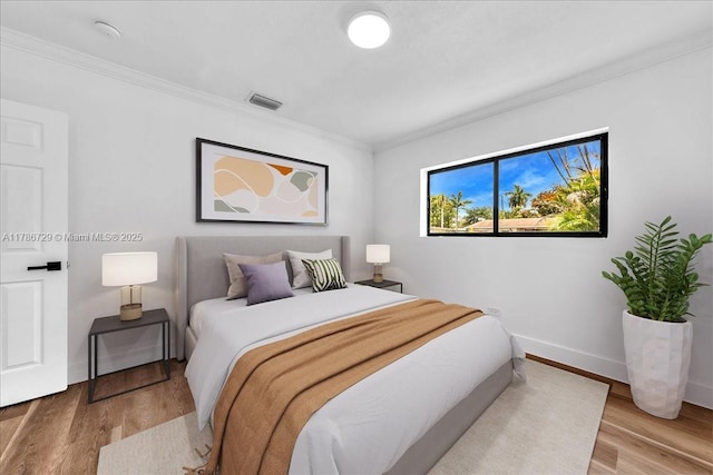 15020 NE 7th Ave, Miami, FL 33161 - bedroom with baseboards, wood finished floors, visible vents, and ornamental molding