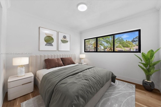 15020 NE 7th Ave, Miami, FL 33161 - bedroom featuring baseboards and wood finished floors