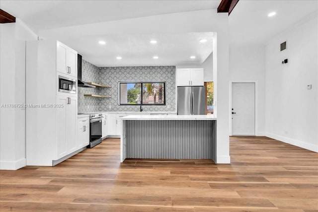 15020 NE 7th Ave, Miami, FL 33161 - kitchen with decorative backsplash, light wood-type flooring, stainless steel appliances, light countertops, and white cabinetry