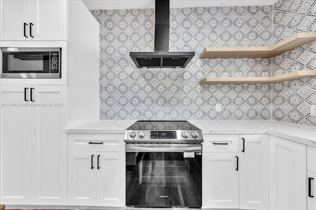 15020 NE 7th Ave, Miami, FL 33161 - kitchen featuring wall chimney exhaust hood, white cabinetry, open shelves, light stone countertops, and appliances with stainless steel finishes