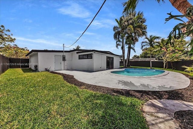 15020 NE 7th Ave, Miami, FL 33161 - view of swimming pool featuring a lawn, a fenced backyard, a fenced in pool, and a patio area