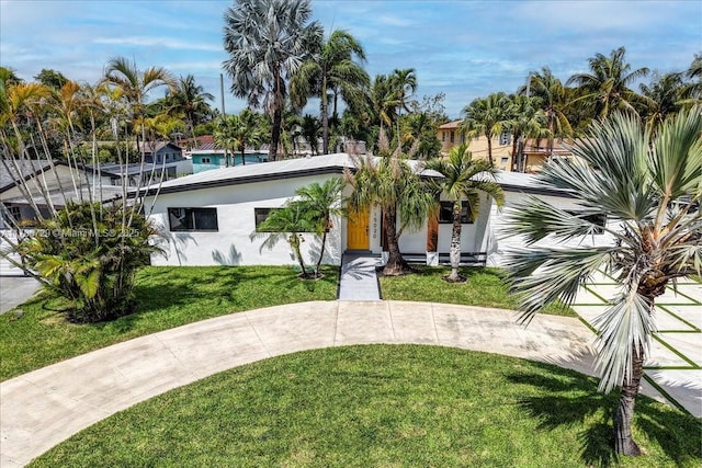 15020 NE 7th Ave, Miami, FL 33161 - view of front of home with stucco siding and a front yard