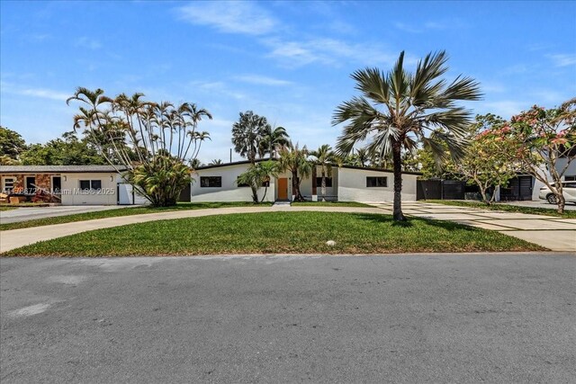 15020 NE 7th Ave, Miami, FL 33161 - view of front facade with curved driveway and a front lawn