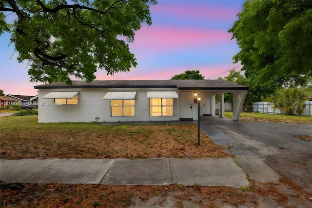 1920 N 66th Ave, Hollywood, FL 33024 - single story home featuring stucco siding, a carport, fence, and concrete driveway