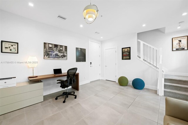 625 NE 22nd Dr, Wilton Manors, FL 33305 - kitchen featuring appliances with stainless steel finishes, wall chimney range hood, a sink, light countertops, and dark brown cabinetry