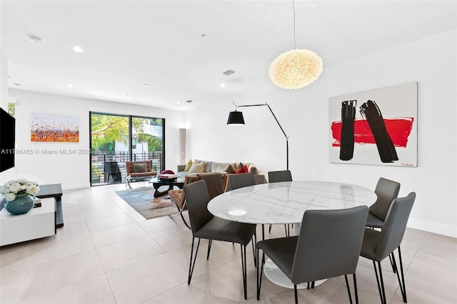 dining space with recessed lighting and light tile patterned floors