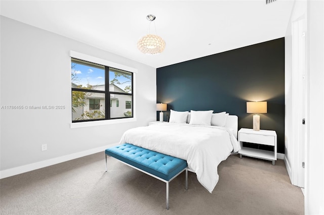 bedroom with baseboards and carpet flooring