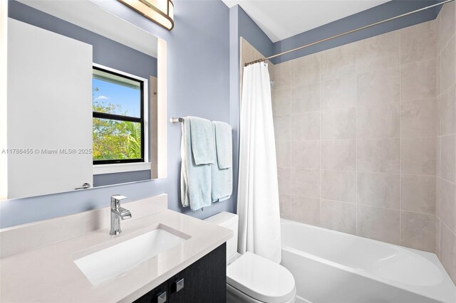 625 NE 22nd Dr, Wilton Manors, FL 33305 - bathroom featuring vanity, toilet, and shower / tub combo