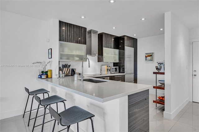 1120 99th St Unit 302, Bay Harbor Islands, FL 33154 - kitchen featuring modern cabinets, a kitchen bar, a peninsula, light countertops, and recessed lighting