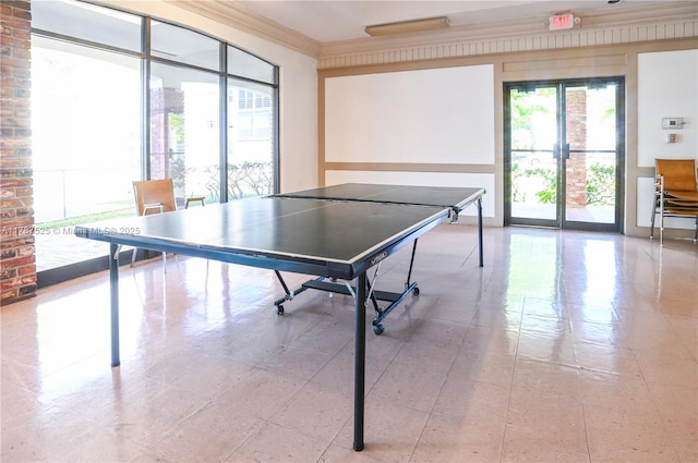 game room with light tile patterned flooring and ornamental molding