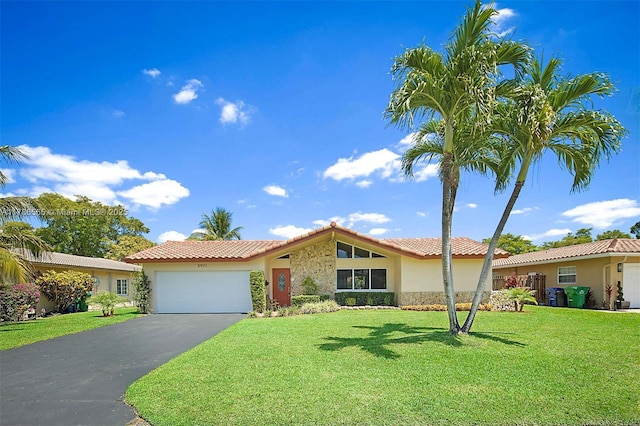 3971 NW 108th Dr, Coral Springs, FL 33065 - ranch-style home with a tile roof, driveway, an attached garage, a front yard, and stucco siding