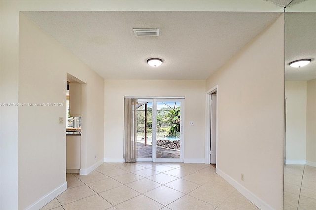 3971 NW 108th Dr, Coral Springs, FL 33065 - spare room featuring a textured ceiling, visible vents, and light tile patterned floors