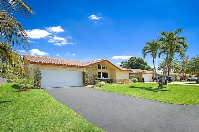 3971 NW 108th Dr, Coral Springs, FL 33065 - view of front of home featuring aphalt driveway, a tiled roof, stucco siding, an attached garage, and a front yard