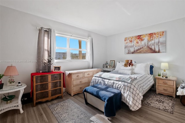 bedroom with wood finished floors