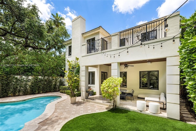 1672 Micanopy Ave, Miami, FL 33133 - rear view of house featuring a balcony, ceiling fan, a patio area, stucco siding, and a chimney