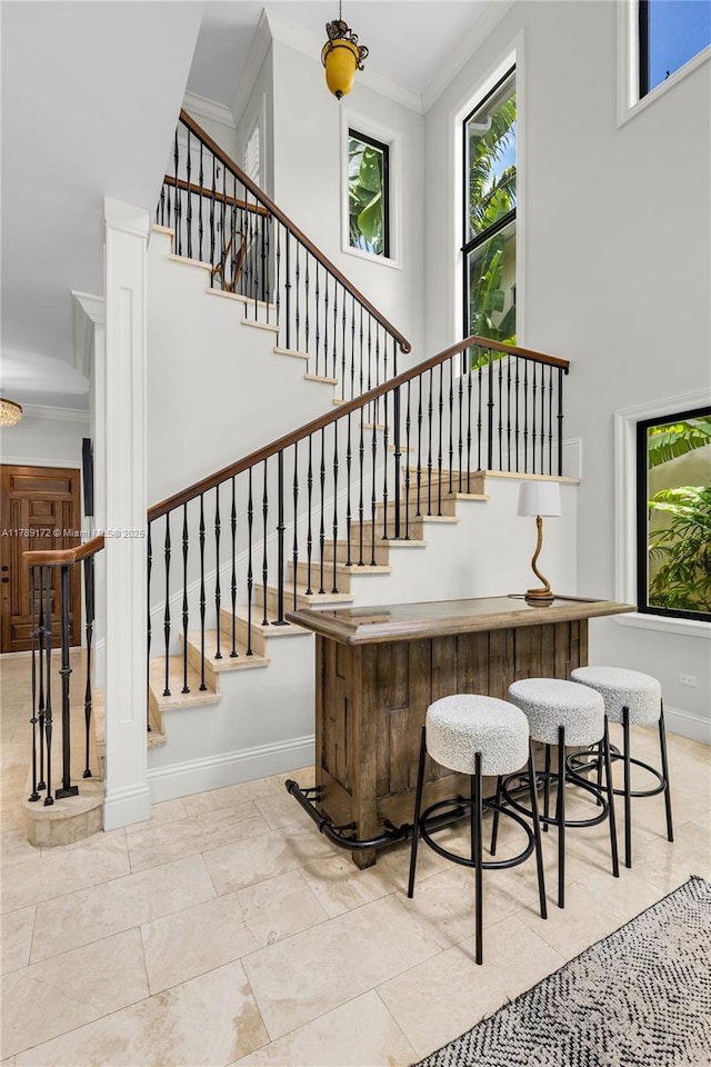1672 Micanopy Ave, Miami, FL 33133 - bar with ornamental molding and stairs