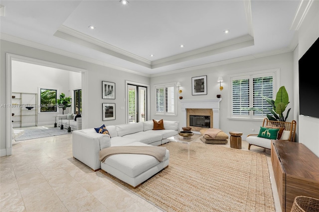 1672 Micanopy Ave, Miami, FL 33133 - living room featuring healthy amount of natural light, a tray ceiling, a high end fireplace, crown molding, and light tile patterned floors